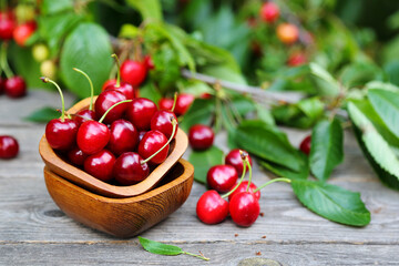 Sweet cherry berries in a wooden bowl