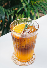 Ice coffee and orange juice. Black Coffee Tonic is the New Iced Coffee With Orange Juice. Cocktail of orange juice, ice and coffee in glass. Glass of espresso shot mixed with orange juice.