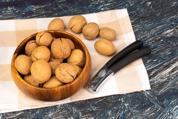 Walnuts in a wooden bowl. Whole walnut. selective focus
