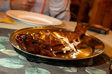 delicious smoked fish on a plate. close-up, selective focus, blurred background