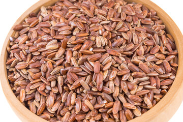 Red rice in a wooden bowl close-up - healthy food