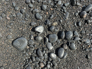 Volcanic rounded rocks smoothed by the ocean at a beach on the Island of Maui, Hawaii