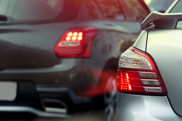 Abstract of rear side car with speed light of brake. Road traffic conditions.