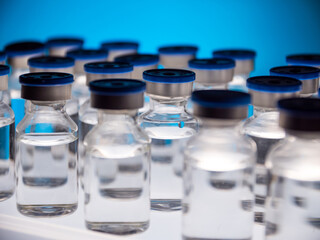 Group of Vaccine bottles. Medicine in ampoules. Glass vials for liquid samples in laboratory.