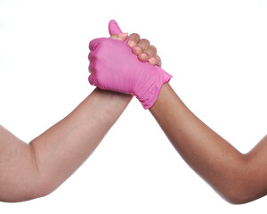 Woman's arms, gloved hands holding on and showing strength.