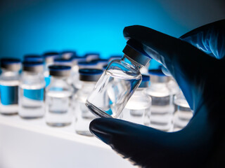 Group of Vaccine bottles. Medicine in ampoules. Glass vials for liquid samples in laboratory.