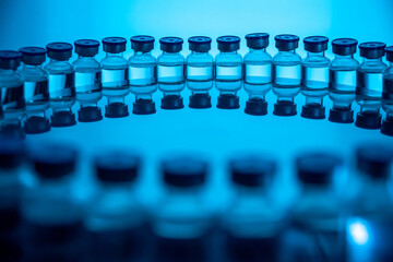 Group of Vaccine bottles. Medicine in ampoules. Glass vials for liquid samples in laboratory.