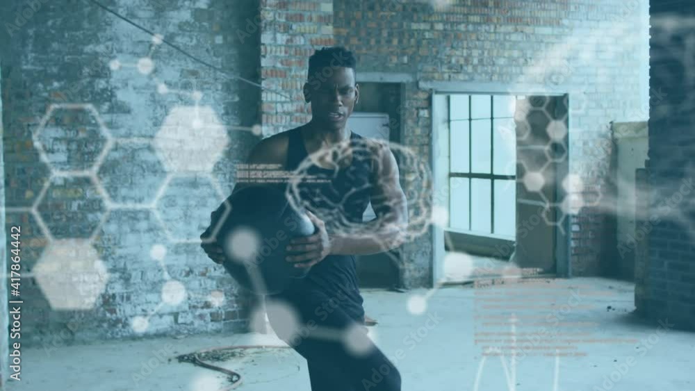 Poster animation of statistics and graphs over man exercising with ball in an abandoned building