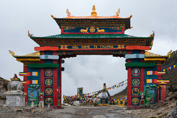 Colorful gateway with Buddhist prayer flags in Himalayas. Tawang, India.