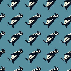Decorative cute seamless pattern with hand drawn penguins silhouettes. Blue background.