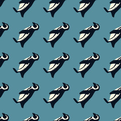 Decorative cute seamless pattern with hand drawn penguins silhouettes. Blue background.