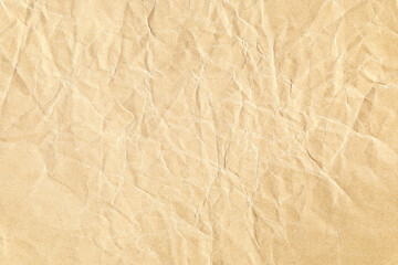 Crumpled brown paper surface background texture
