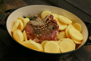 Raw meat with potatoes in a rabbit.