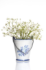 White flowers in a ceramic bucket. Postcard. White background. Isolate. Place for your text.