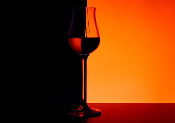 Tulip glass on a red and black background