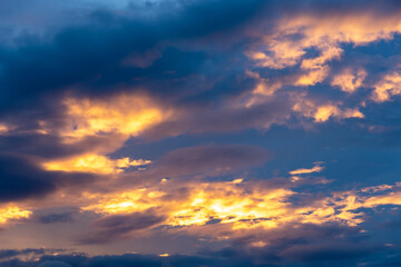 Naklejka na ściany i meble Amazing sunset in cloudy sky.