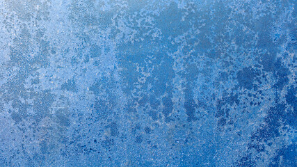 Obraz premium Blurred frosty pattern on glass window wirh bokeh. Luxury shining glowing textured background for graphic design and wallpaper. Copy space for text