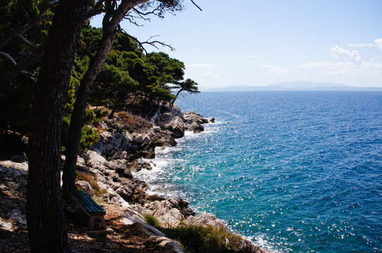 A bench with a sea view in the Osejava Forest Park. Makarska, Croatia