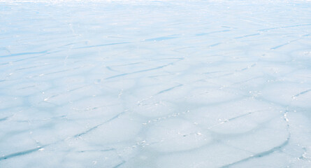 frozen sea in winter. Ice structures and ice crystals. Nature background with copy space. Climate change and control.