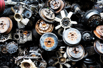 Close-up of Used and surplus car engines and accessories of the car at the repair service garage. Selective focus