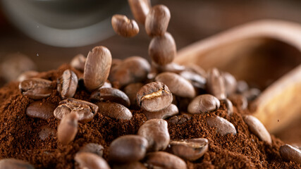 Falling Roasted Coffee Beans on Brown Background, close-up.