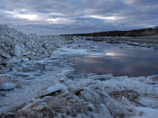 Spring coast of the Arctic Ocean. Beautiful sky and ice crystals. Artistic noise
