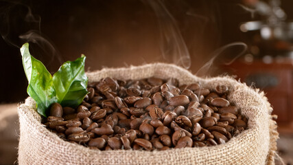 Falling Roasted Coffee Beans into Jute Bag, close-up.