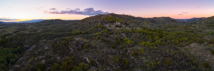 Drone aerial panorama of Termas Radium Hotel Serra da Pena at sunset in Sortelha, Portugal