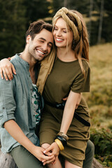 Loving young couple hugging and smiling together on nature background