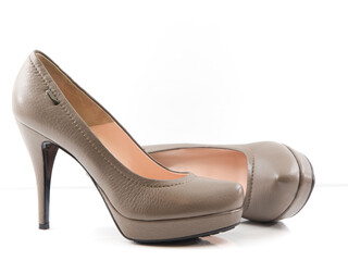 beige women's shoe on high heel, view from side