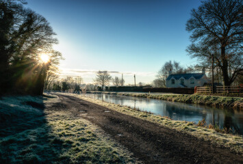 Frosty canal landscape at dawn