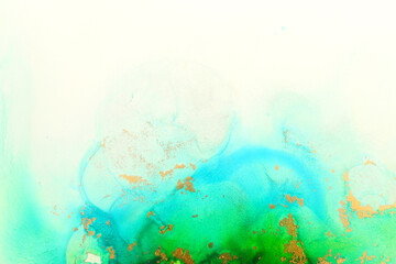 art photography of abstract fluid art painting with alcohol ink, ocean colors, green, turquoise, blue and gold