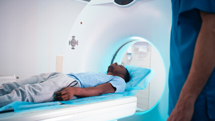 Black patient talking with doctor about CT scan