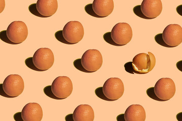 Oranges standing on pastel background pattern minimal
