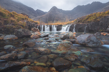 Fototapeta na wymiar Moody, dramatic mountain and waterfall landscape of the Fairy Pools and Black Cuillins at Glen Brittle on the Isle of Skye in the Scottish Highlands, Scotland.