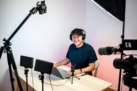 Gamer, streamer, or Youtuber streaming and recording in his studio