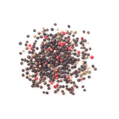 Heap of whole black, white, green and pink peppercorns