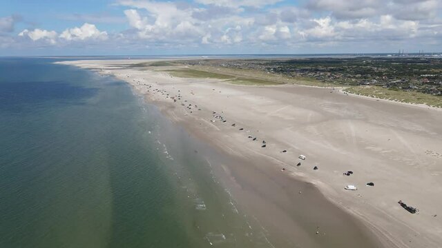 Beach aerial with cars and tourists. Fanoe, Denmark