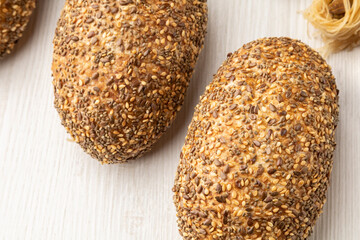closeup to a whole wheat bread with sesame, study taking of food