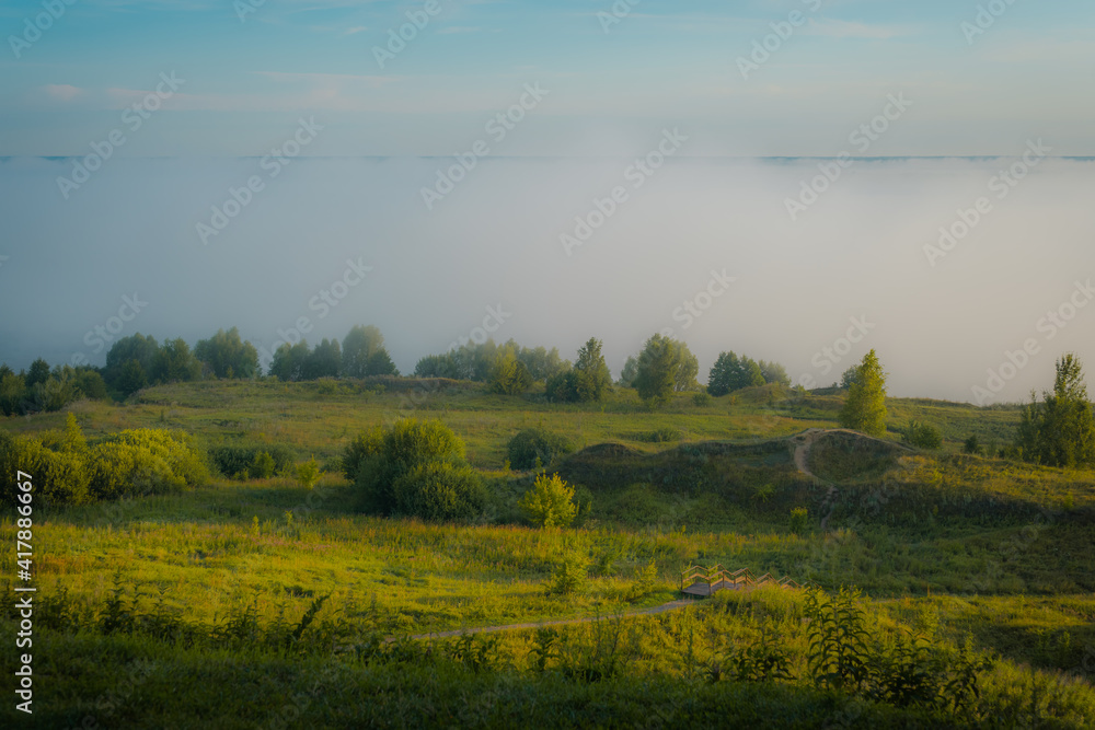 Wall mural landscape with fog