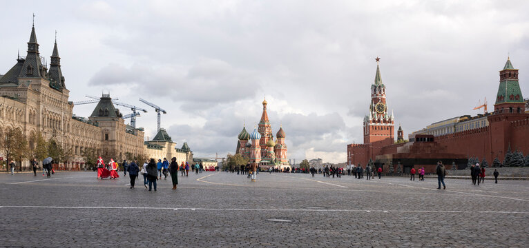  Tourists walk on Red Square and take pictures for memory