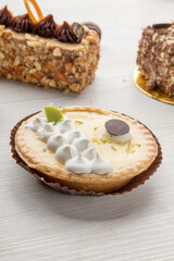 appetizing pieces of cake and lemon pie with cream detail of the textures, pastry in studio
