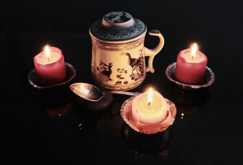 Chinese tea served in a nice teapot around candles