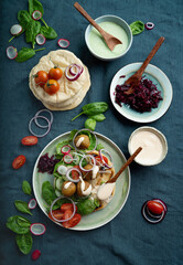 Home made vegan falafel  served with various mezze and pita bread