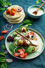 Home made vegan falafel  served with various mezze and pita bread