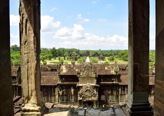 Pillars showing the gardens and walkway of Angkor Wat