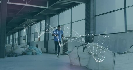 Animation of dna strand spinning over man running, exercising in gym - Powered by Adobe