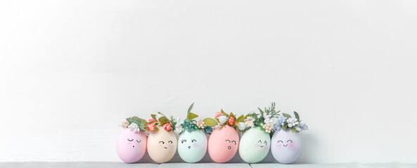 decorative easter eggs on a light wooden background. Easter-themed background with place for text - 417888830
