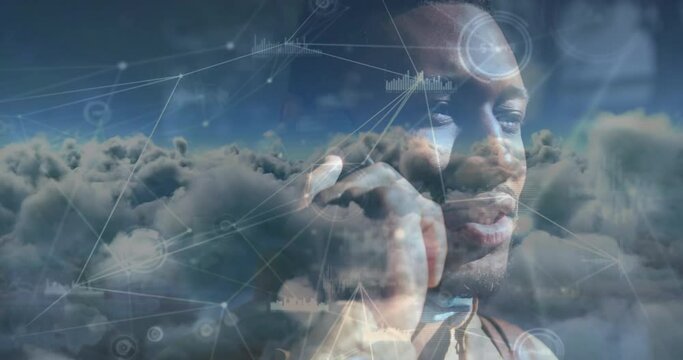 Animation of clouds and a network of connections with smiling man talking on smartphone