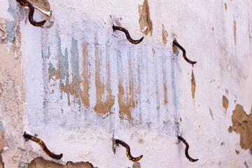 old texture . restoration of buildings. overhaul of premises. fittings sticking out of a dilapidated building.